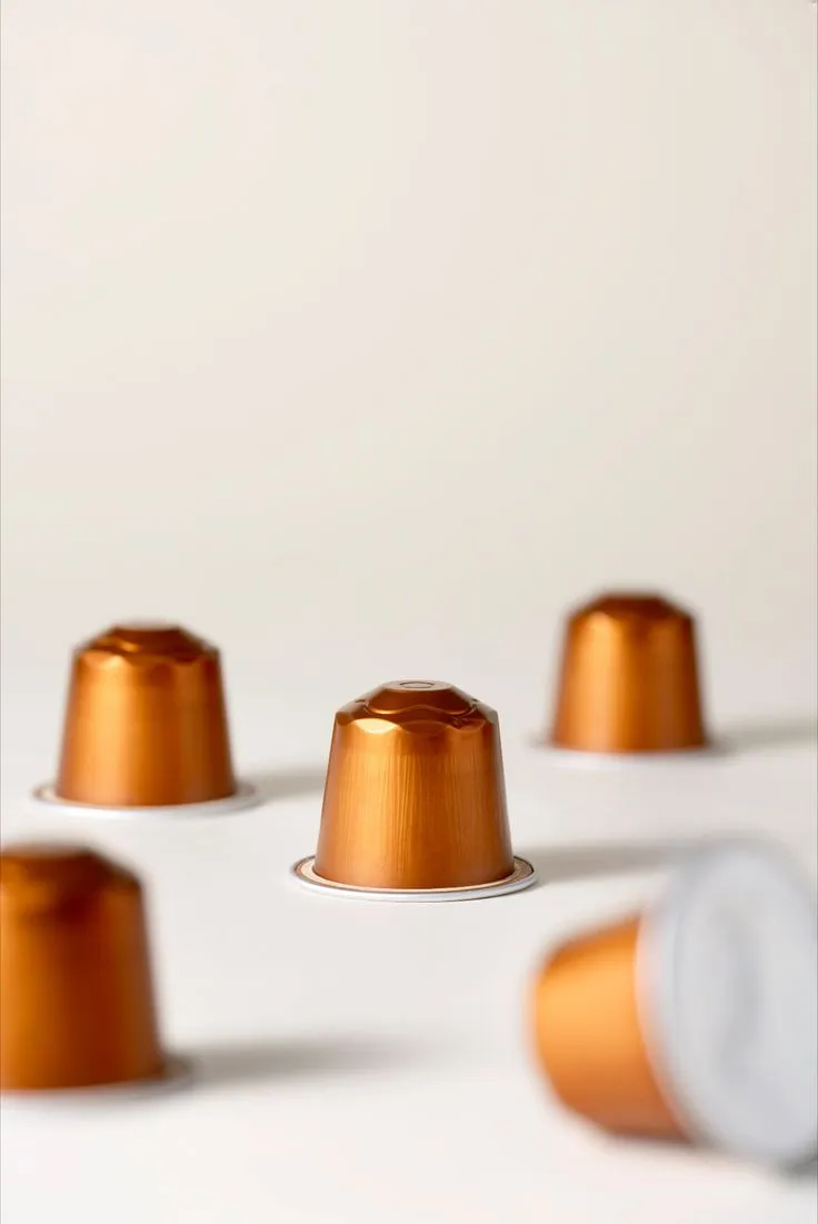 Capsules de café compatibles, finition cuivrée
